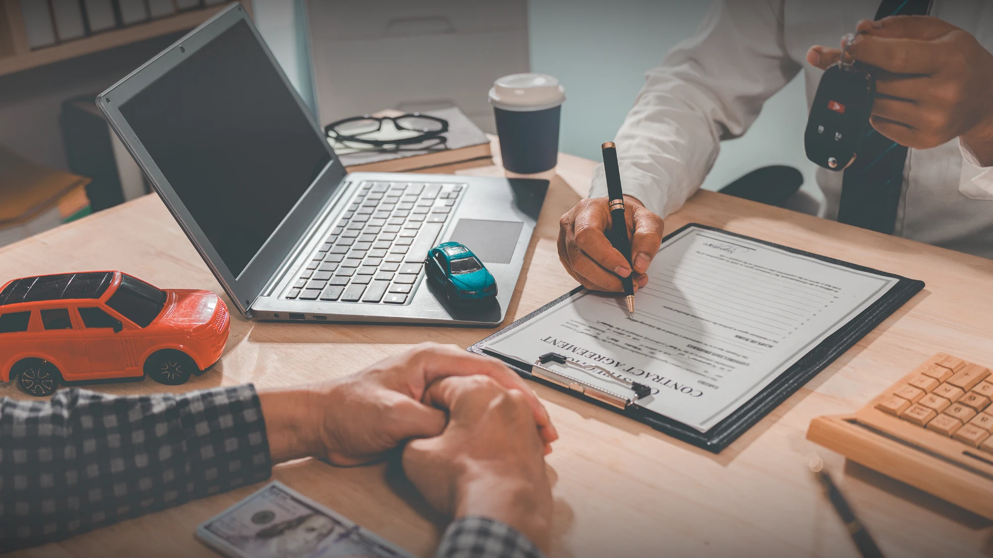 Connecticut driver reviewing auto insurance requirements with an insurance agent